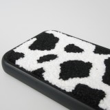 Coque iPhone 15 Pro - Silicone avec surface tufting effet peau de vache - Noir