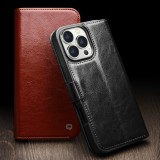 Fourre iPhone 16e - Flip Qialino cuir véritable avec fermeture magnétique - Noir