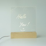 Tableau de messages transparent avec lumière LED et socle en bois