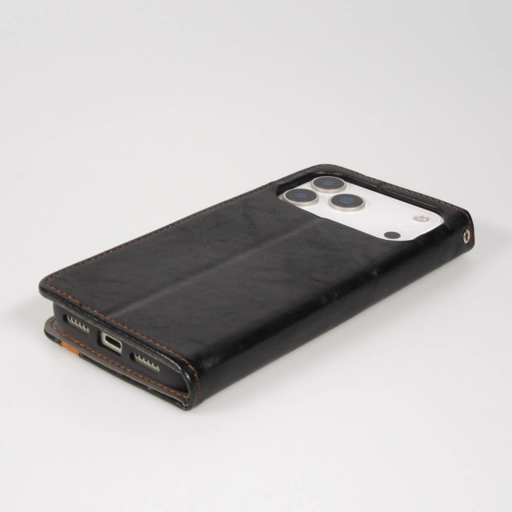 Etui cuir iPhone 17 Pro - Flip Wallet en cuir véritable avec stripe design et compartiment à cartes - Noir
