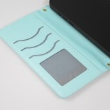 Fourre iPhone 16 Pro - Flip matelass&eacute; &eacute;l&eacute;gant avec fermeture magn&eacute;tique et lani&egrave;re et emplacements pour cartes - Turquoise