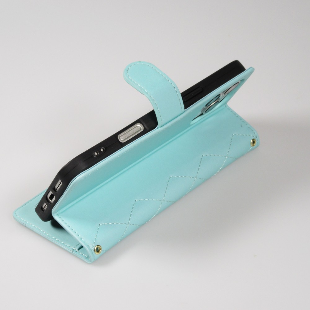 Fourre iPhone 16 Pro Max - Flip matelass&eacute; &eacute;l&eacute;gant avec fermeture magn&eacute;tique et lani&egrave;re et emplacements pour cartes - Turquoise
