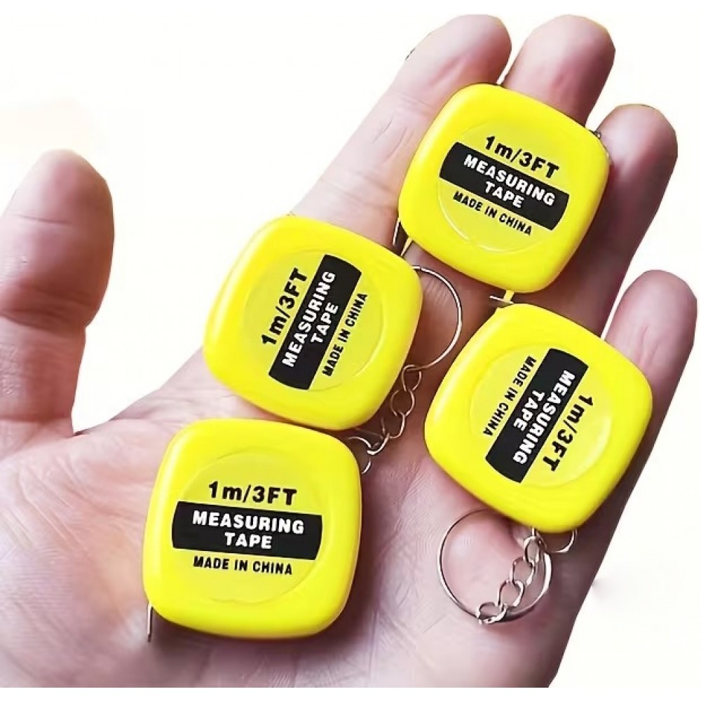 Mini m&egrave;tre ruban porte-cl&eacute;s r&eacute;tractable longueur 1m m&eacute;tallique compact avec double graduation cm/pouces - Jaune